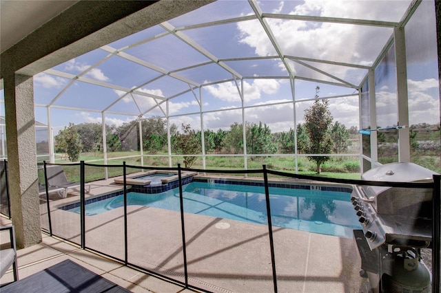 view of pool featuring a lanai, area for grilling, an in ground hot tub, and a patio