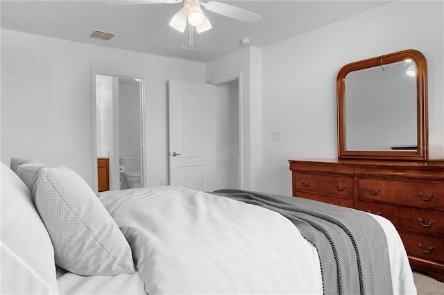 bedroom featuring connected bathroom, ceiling fan, and carpet floors