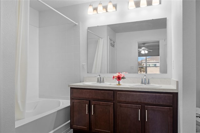 bathroom featuring shower / bath combo, vanity, and ceiling fan