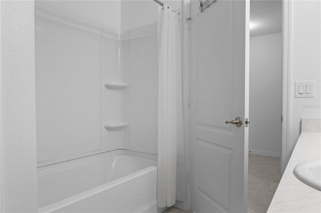 bathroom featuring vanity and shower / bath combo with shower curtain