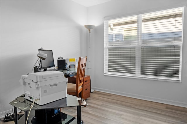 office with light wood-type flooring