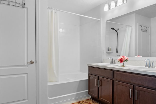 bathroom featuring vanity and shower / bathtub combination with curtain