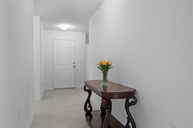 hallway with light tile patterned floors