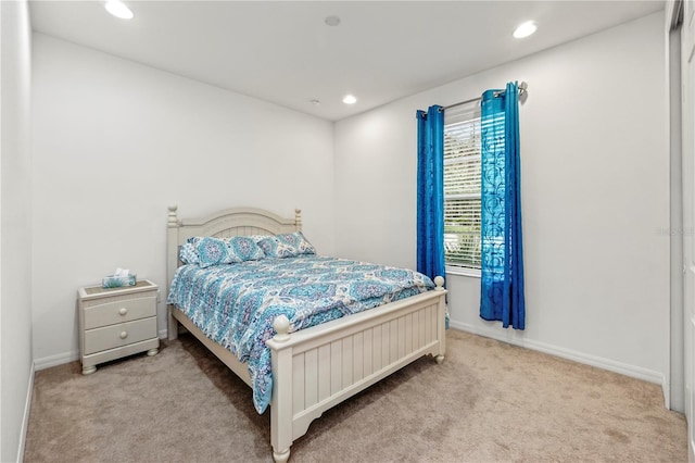 bedroom with light colored carpet