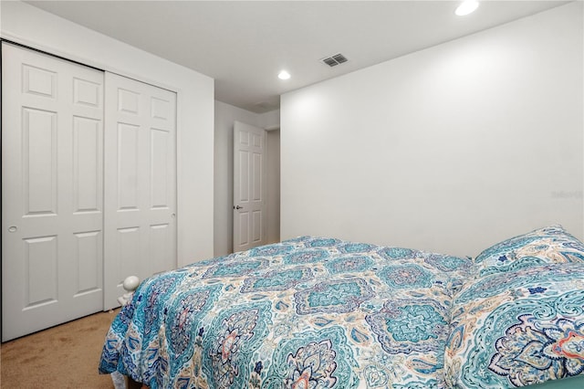 bedroom with a closet and carpet