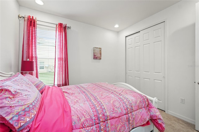 bedroom with a closet and carpet floors