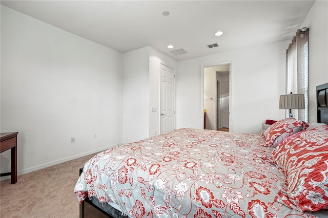 bedroom featuring light colored carpet