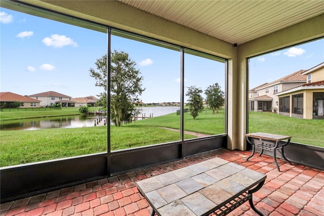 sunroom with a water view