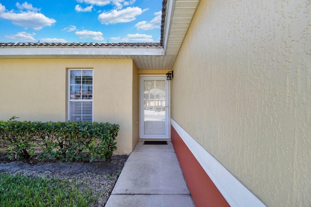 2216 Mystic Ring Loop, Poinciana, FL 34759 - property entrance featuring stucco siding