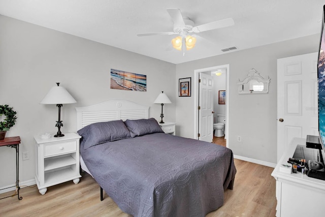 2216 Mystic Ring Loop, Poinciana, FL 34759 - bedroom featuring light wood finished floors, connected bathroom, and ceiling fan