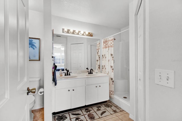 2216 Mystic Ring Loop, Poinciana, FL 34759 - bathroom featuring tile patterned floors, double vanity, and curtained shower