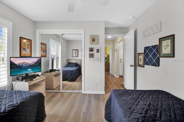 2216 Mystic Ring Loop, Poinciana, FL 34759 - bedroom featuring wood finished floors, a closet, and ceiling fan