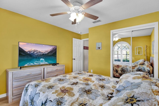 2216 Mystic Ring Loop, Poinciana, FL 34759 - bedroom with wood finished floors, ceiling fan, and a closet