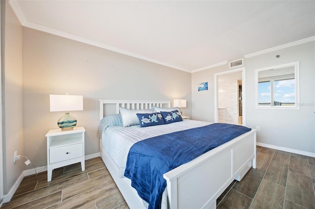 bedroom with ensuite bath, hardwood / wood-style floors, and ornamental molding