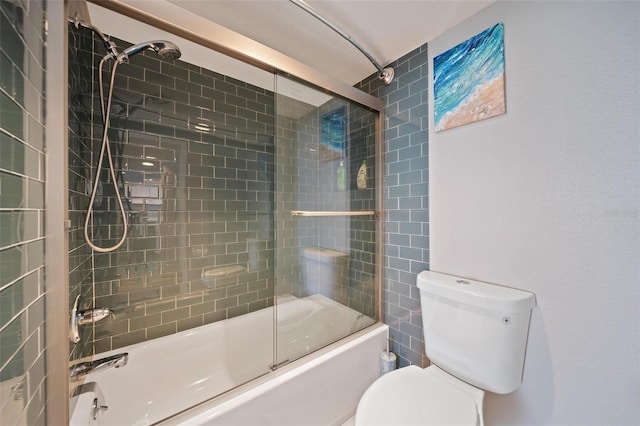 bathroom with toilet and enclosed tub / shower combo