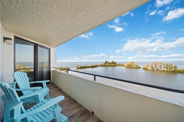 balcony featuring a water view