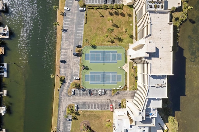 birds eye view of property with a water view