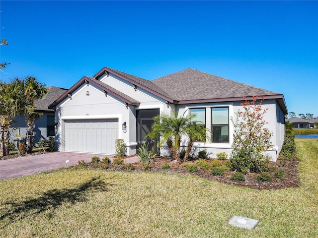 view of front of house with a front lawn and a garage