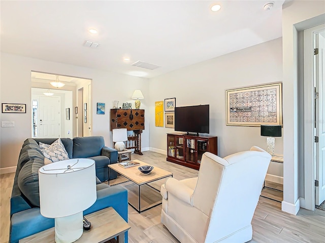 living room with light hardwood / wood-style flooring