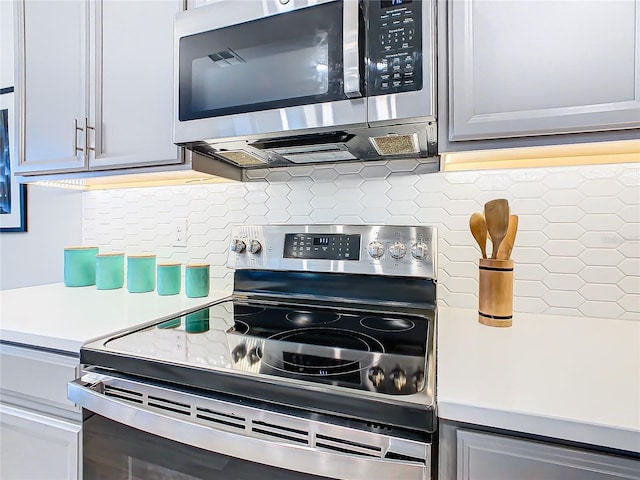 kitchen with backsplash and stainless steel appliances