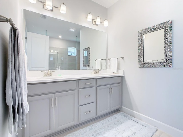 bathroom with vanity and a shower with shower door