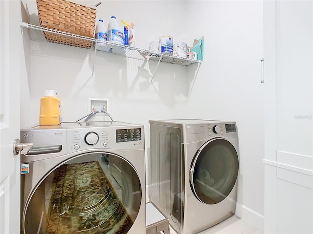 washroom featuring washing machine and dryer