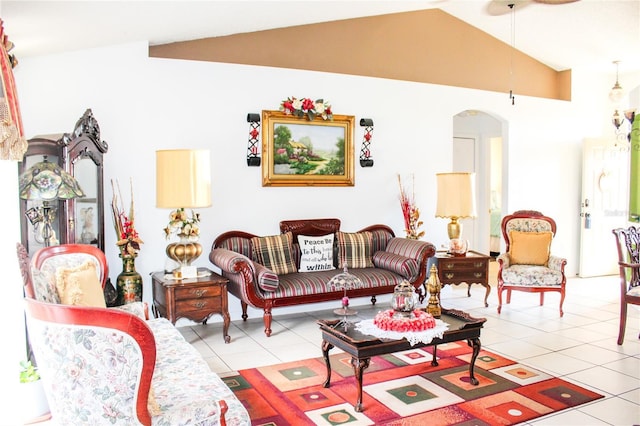 1053 Hemingway Dr, Deltona, FL 32725 - living room with arched walkways, light tile patterned flooring, and vaulted ceiling