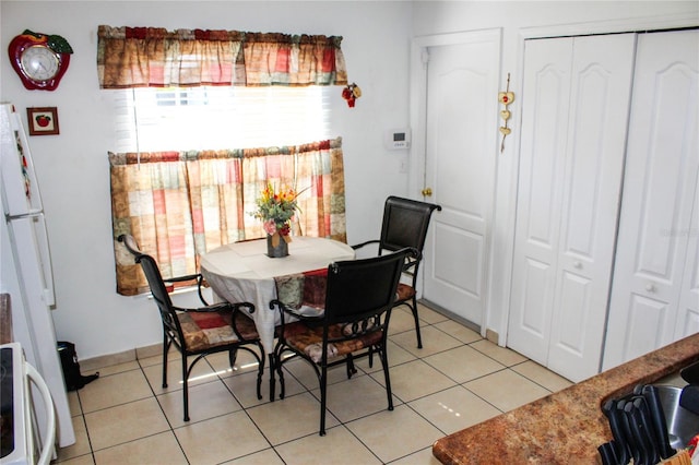 1053 Hemingway Dr, Deltona, FL 32725 - dining area featuring light tile patterned floors