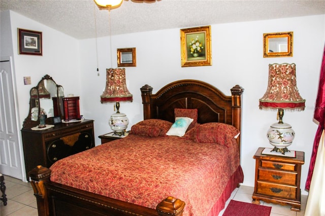 1053 Hemingway Dr, Deltona, FL 32725 - bedroom with light tile patterned flooring and a textured ceiling