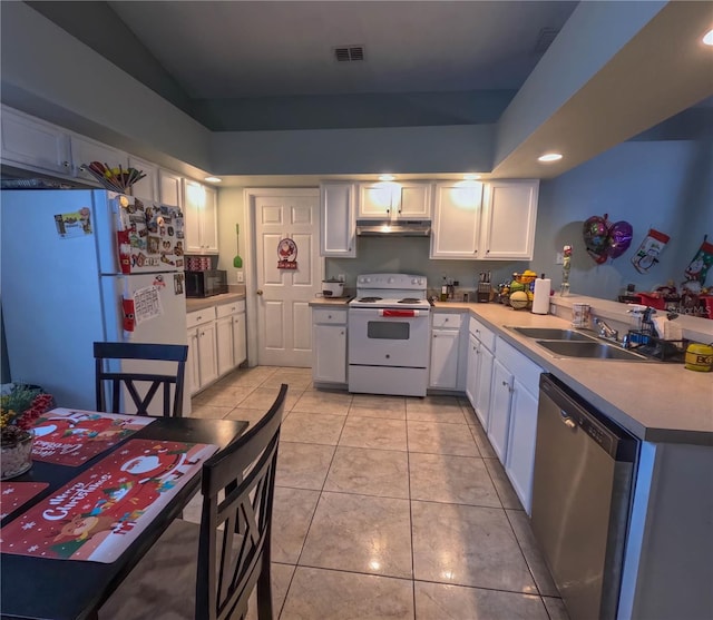 kitchen with white cabinets, white appliances, light tile patterned flooring, and sink