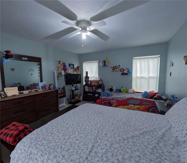 bedroom featuring a textured ceiling and ceiling fan