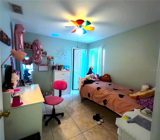 bedroom with light tile patterned flooring and ceiling fan