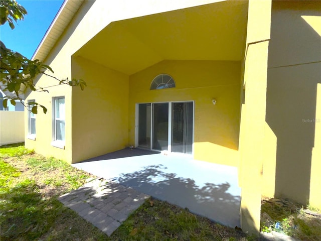 rear view of house featuring a patio