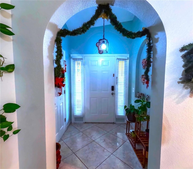 tiled entryway with plenty of natural light