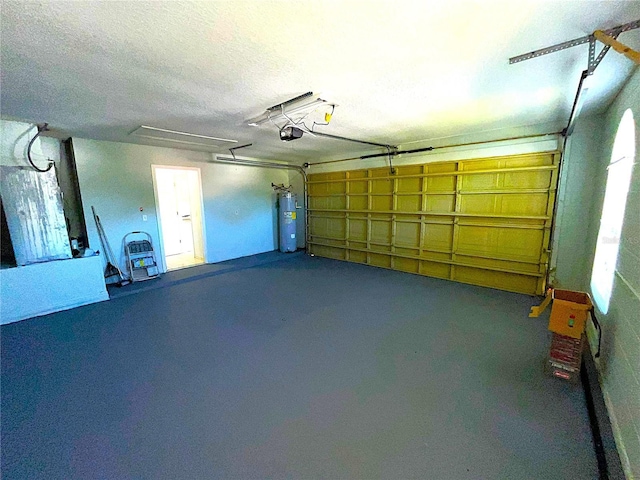 garage with electric water heater and a garage door opener