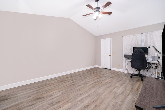 office area featuring ceiling fan, light hardwood / wood-style flooring, and lofted ceiling