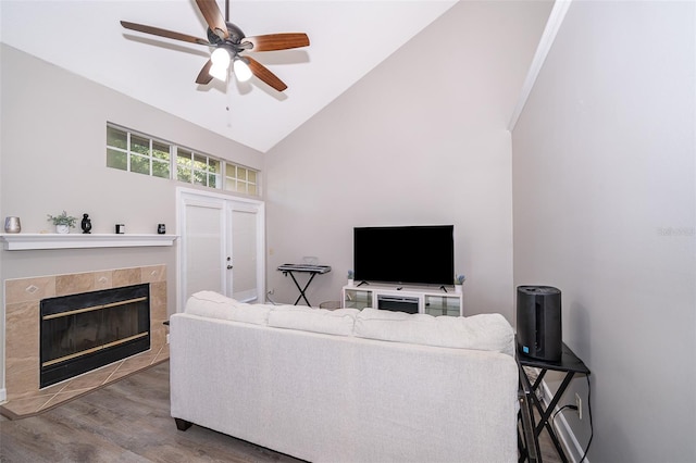1423 Farrindon Cir Unit 1423, Lake Mary, FL 32746 - living room featuring wood finished floors, high vaulted ceiling, ceiling fan, and a fireplace
