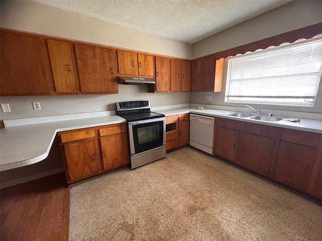 kitchen with a textured ceiling, white dishwasher, stainless steel electric range oven, and sink