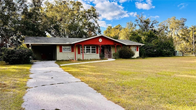 single story home with a front lawn and a carport