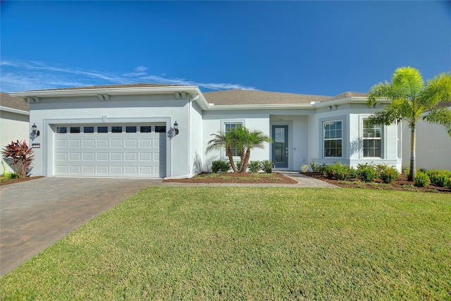 view of front facade featuring a garage and a front lawn