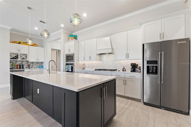 kitchen featuring a spacious island, white cabinetry, stainless steel appliances, and custom exhaust hood