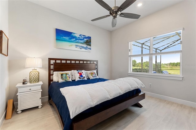 bedroom featuring light hardwood / wood-style floors and ceiling fan