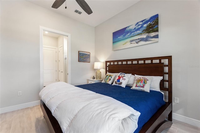 bedroom with ceiling fan and light wood-type flooring