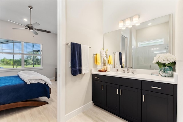 bathroom with a shower, vanity, and ceiling fan