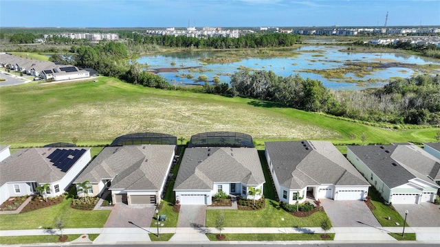 birds eye view of property with a water view