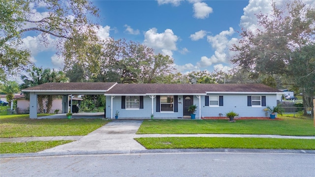 single story home featuring a carport and a front lawn