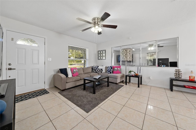 tiled living room featuring ceiling fan