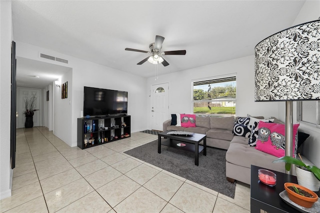 living room featuring ceiling fan and light tile patterned floors