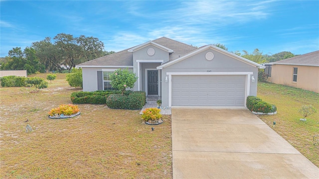 ranch-style home featuring a garage and a front lawn