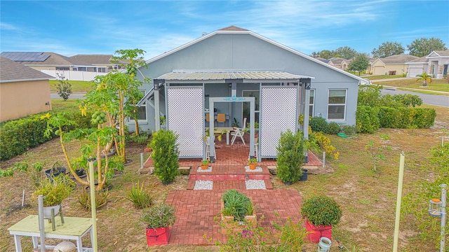 rear view of property with a patio